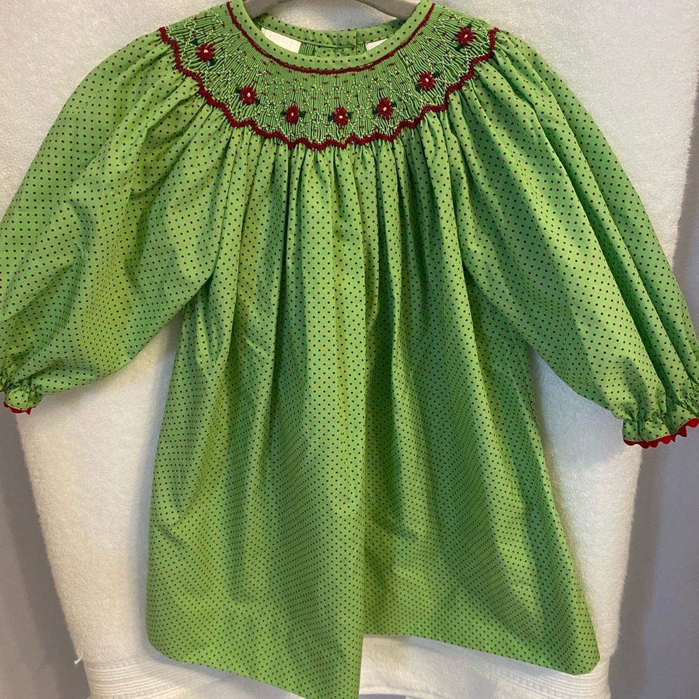 Excellent used condition, green with red polka dot smocked dress, size 12 mo.
